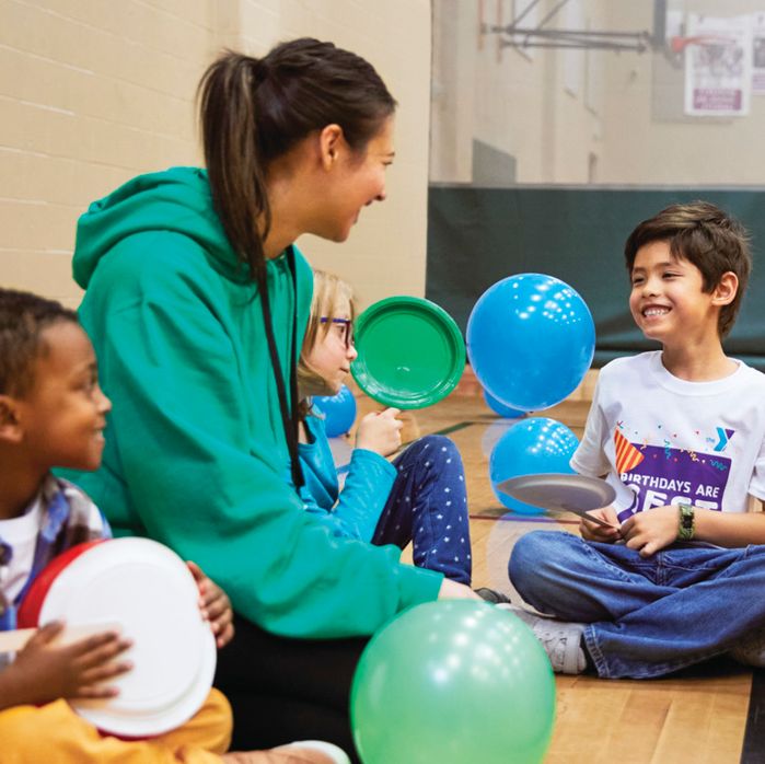 Kids enjoy activities and games in the gym at the YMCA Schools Out Program for when school is out of session.