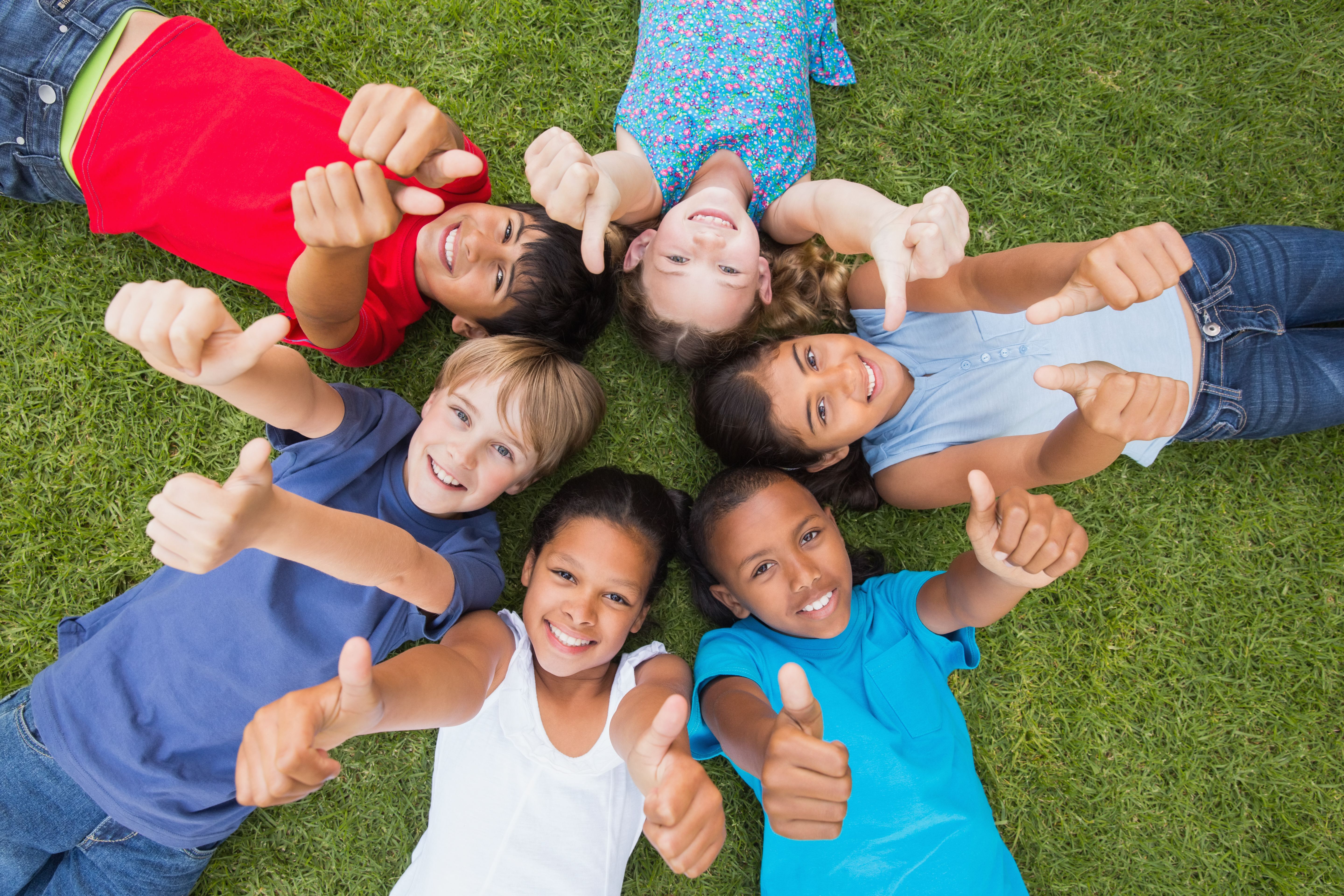 children giving a thumbs up