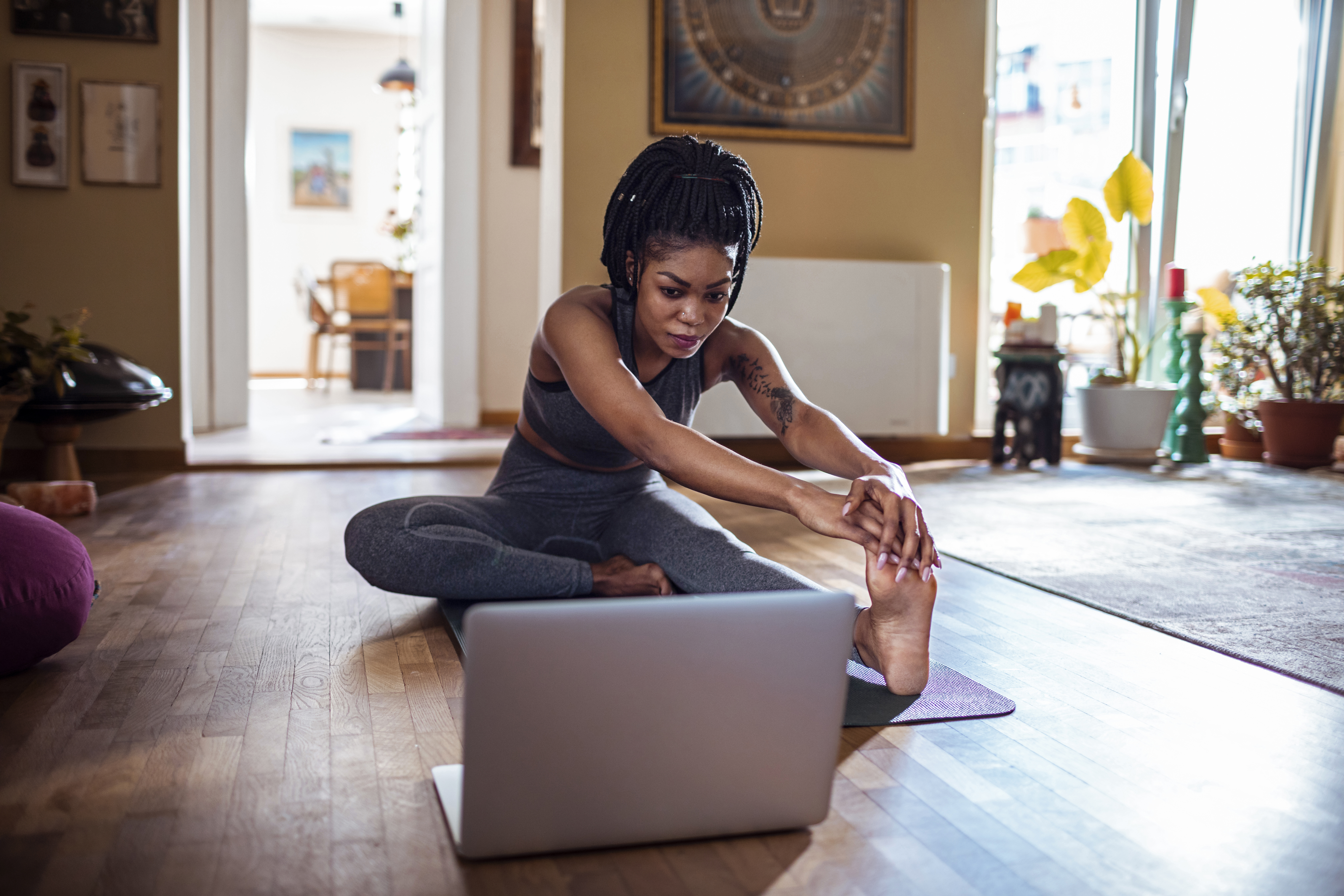 woman stretching at home