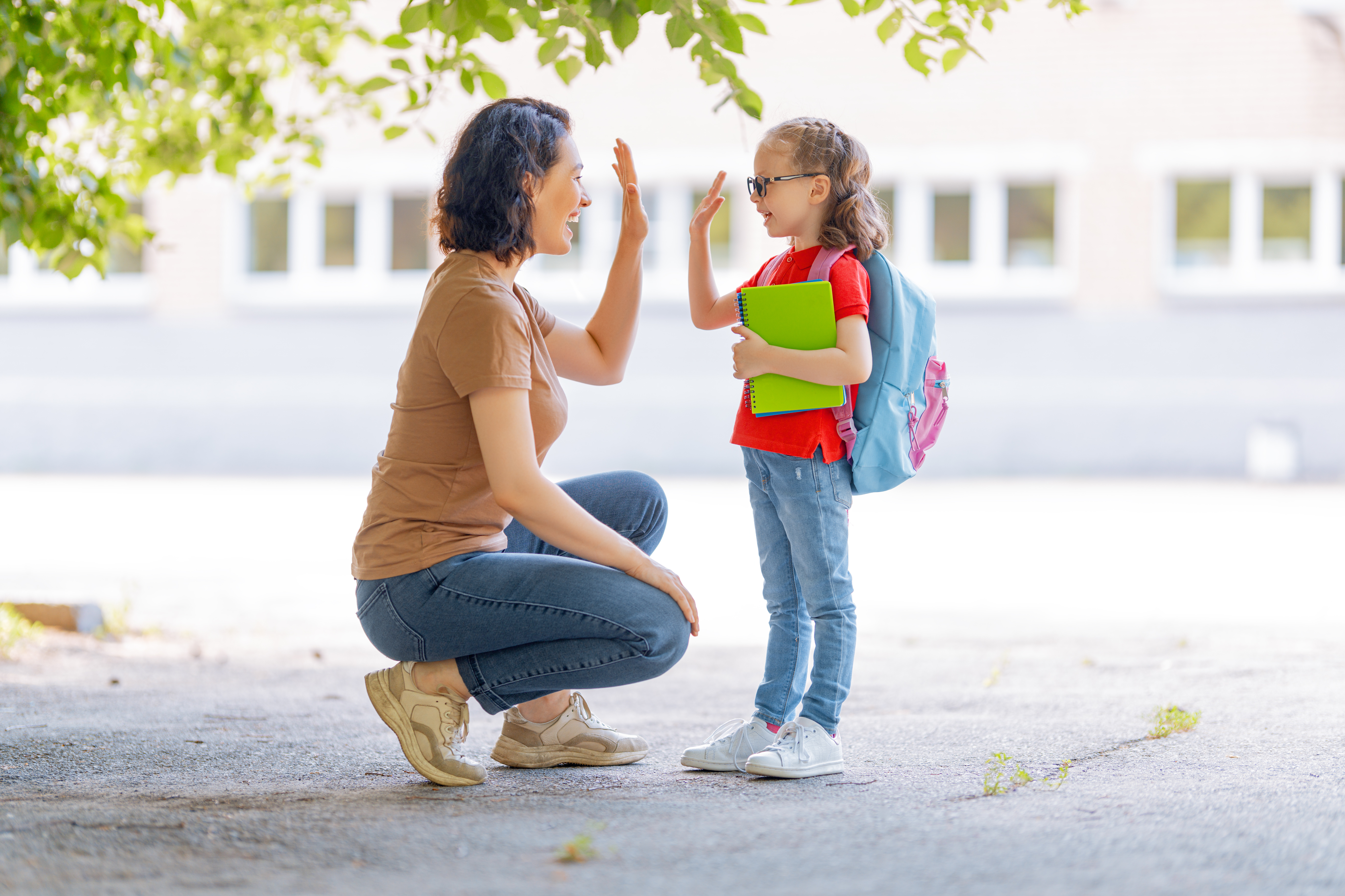 kid going back to school with their parent