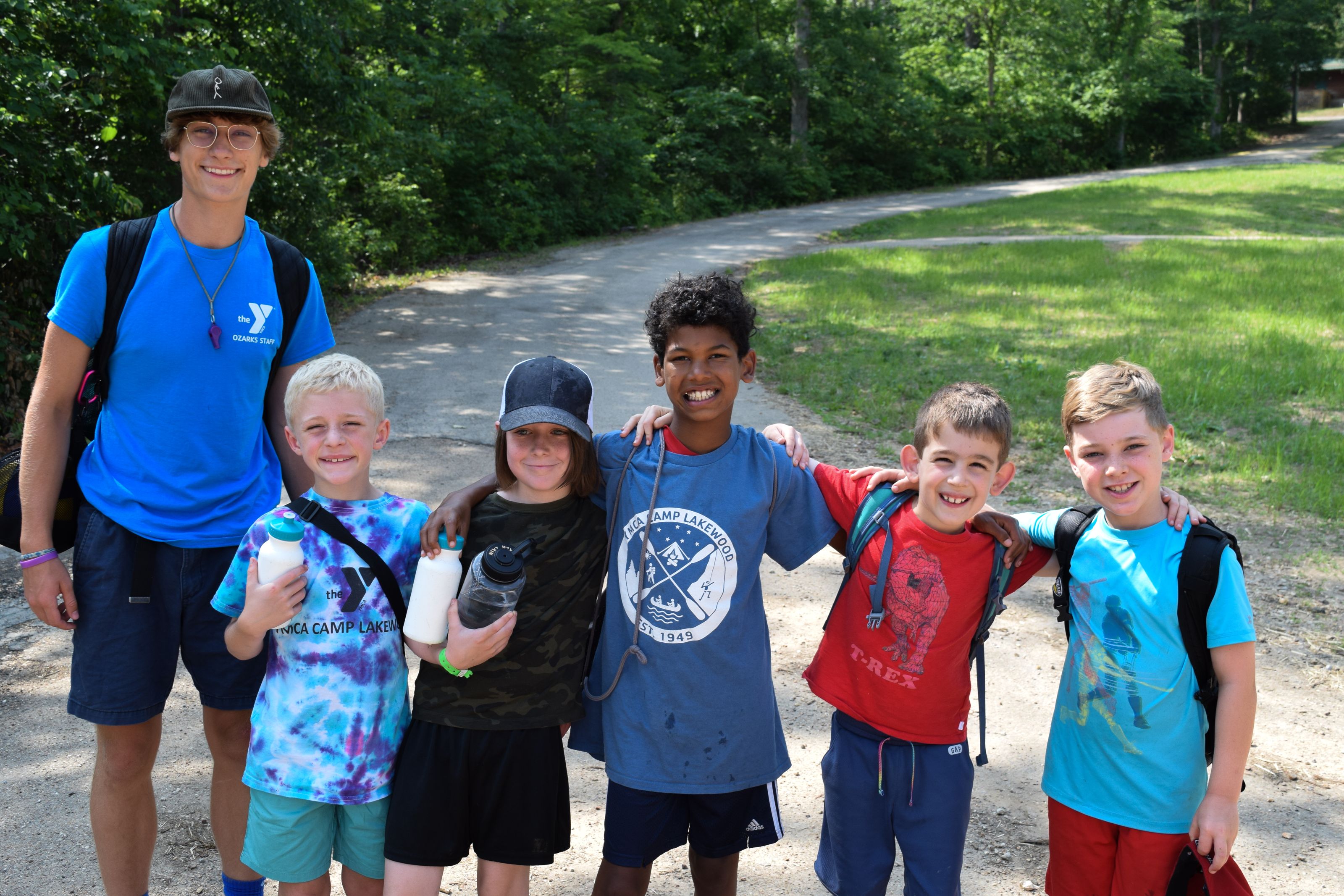 young campers and counselor smiling at ymca camp lakewood