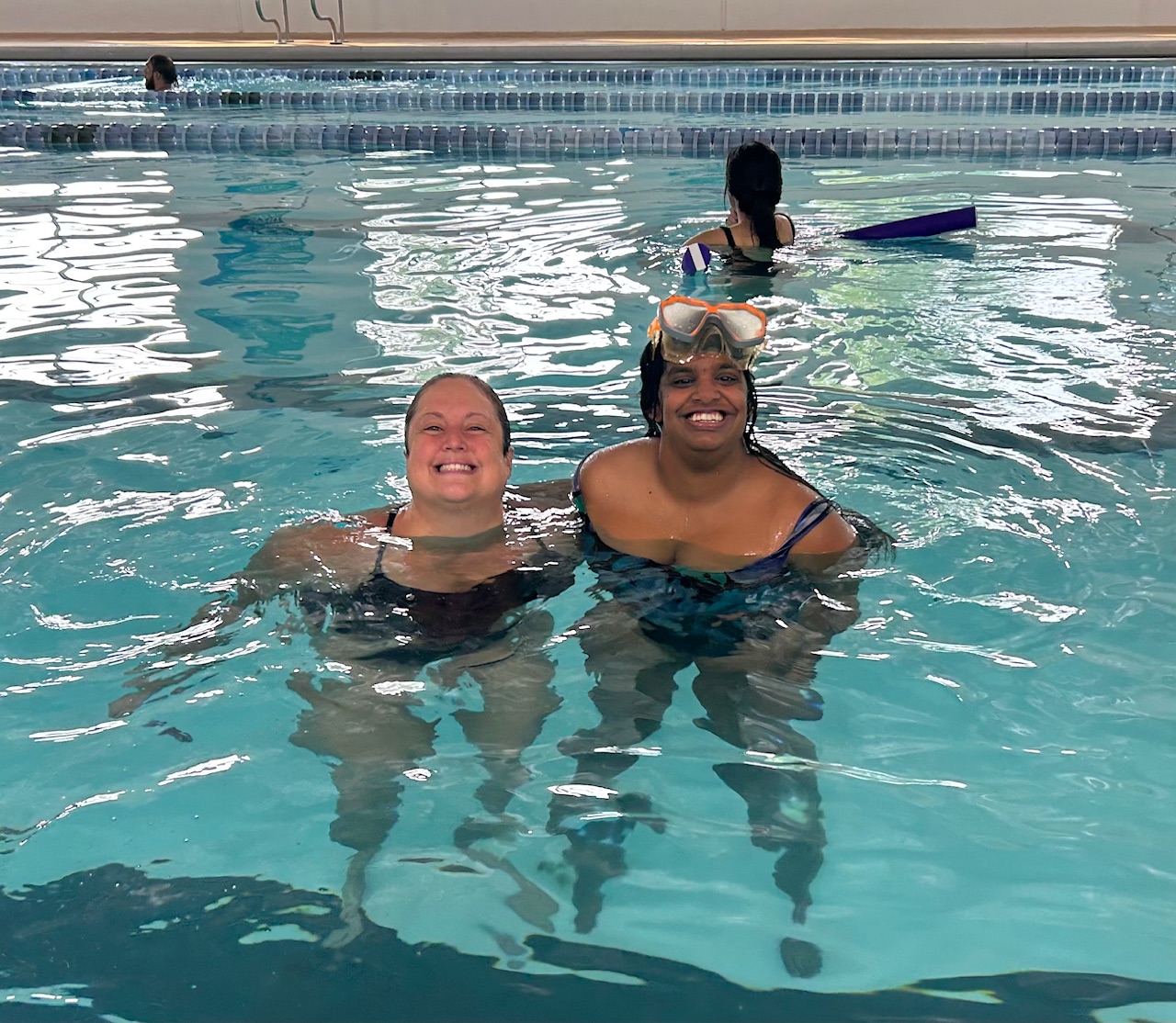 Megan and Chelsi participating in swimming activities at the Monroe County YMCA