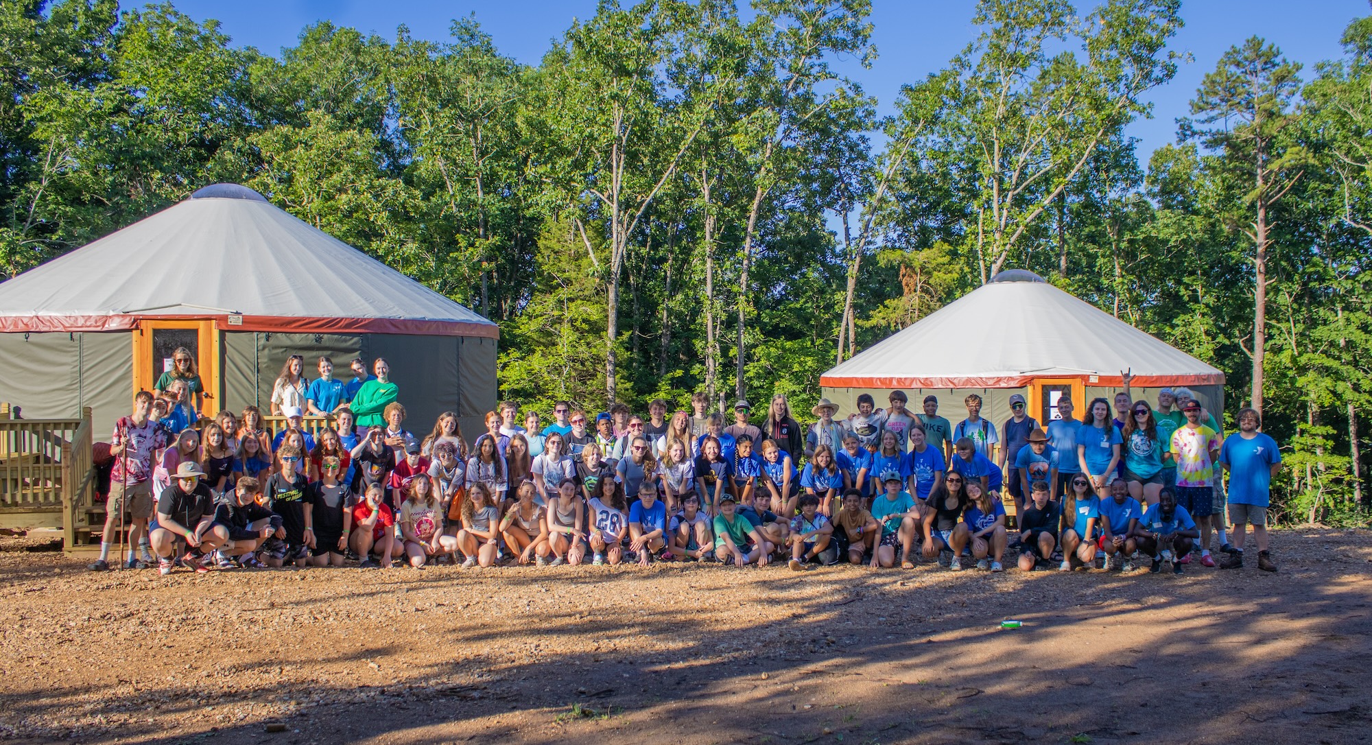 Campers gathered outside East Camp yurts