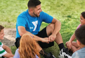 camp counselor with campers