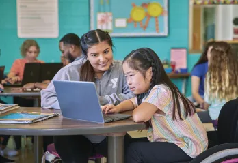 young woman tutoring a little girl at the YMCA