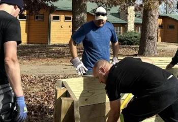people building gaga pit at ymca camp lakewood