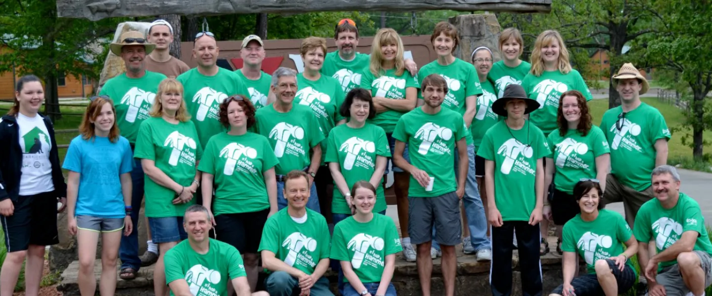 Alum group in green shirts