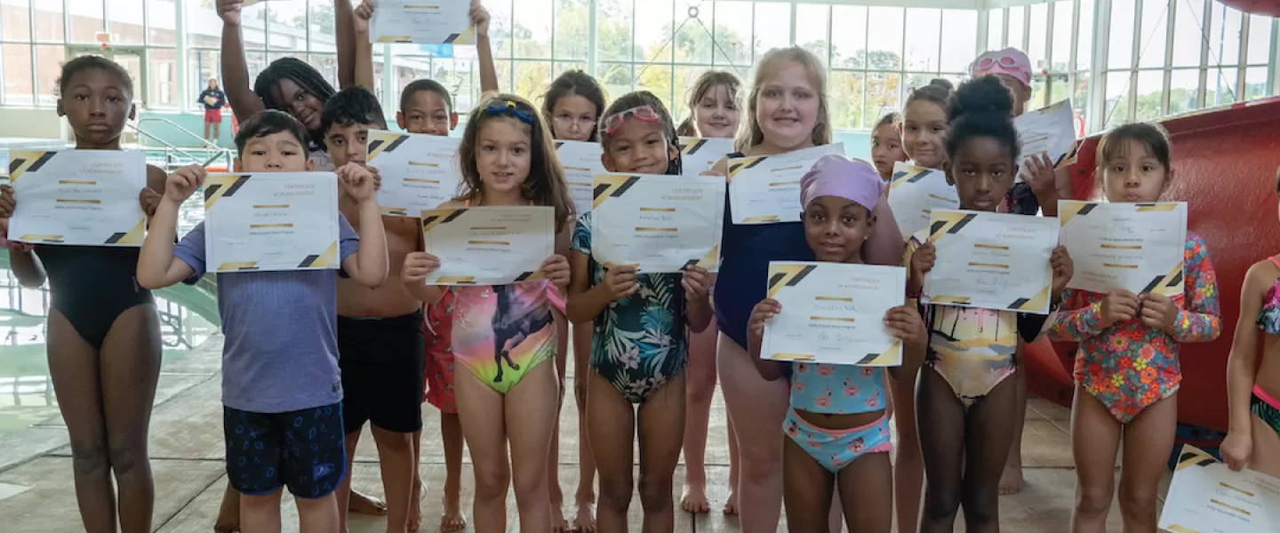 YMCA Go for Green Water Safety Program Class Participants with Certificates of Achievement