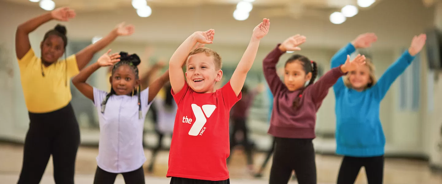 group of kids dancing at the ymca