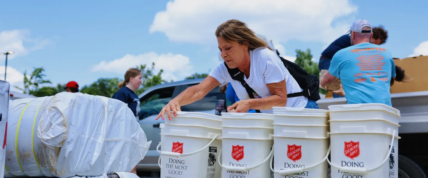 Salvation Army volunteer assisting with tornado relief donations at the O'Fallon Park Rec Complex YMCA