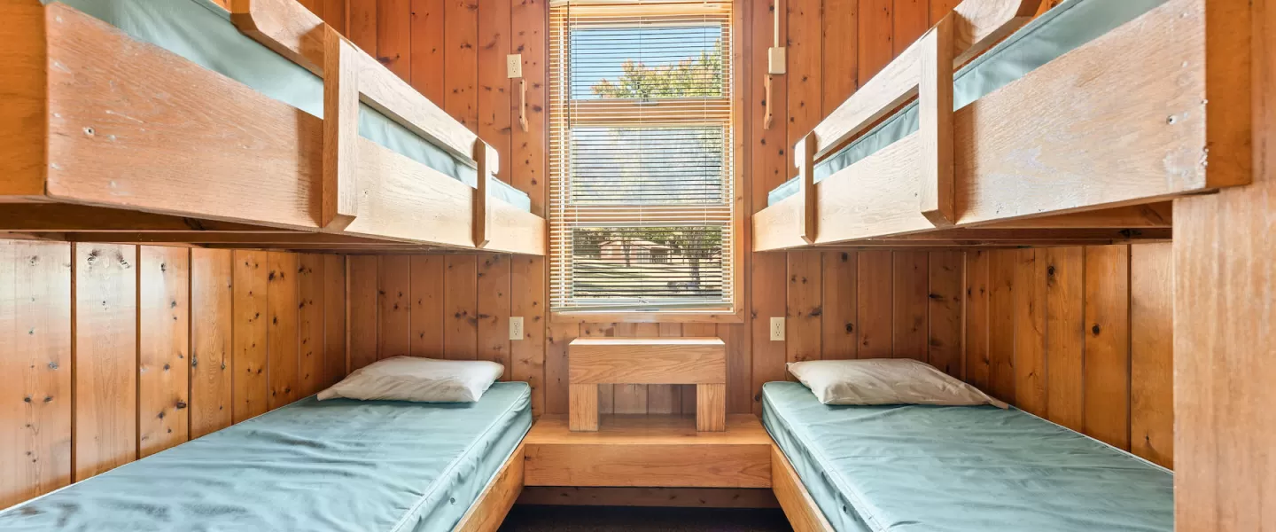 Bunk room with two twin-over-twin bunk beds sleeping four guests, ideal for families or kids