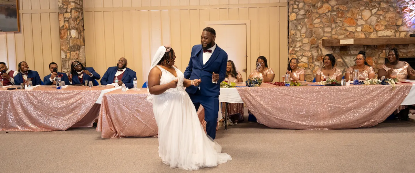 Newly married couple sharing their first dance during their joyful wedding reception at Trout Lodge.