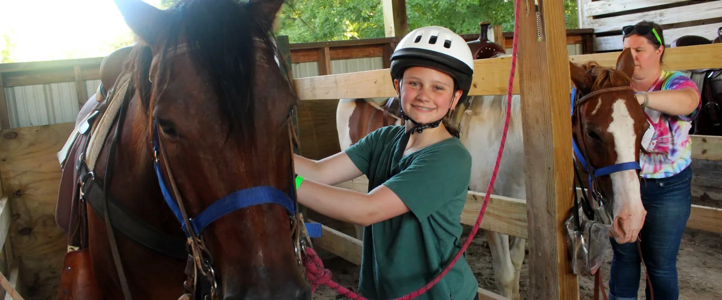 YMCA Camp Lakewood Equestrian Camp Girl smiling with her camp Horse, Rocco