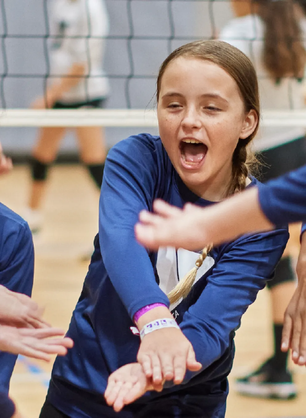 ymca youth volleyball team doing a chant