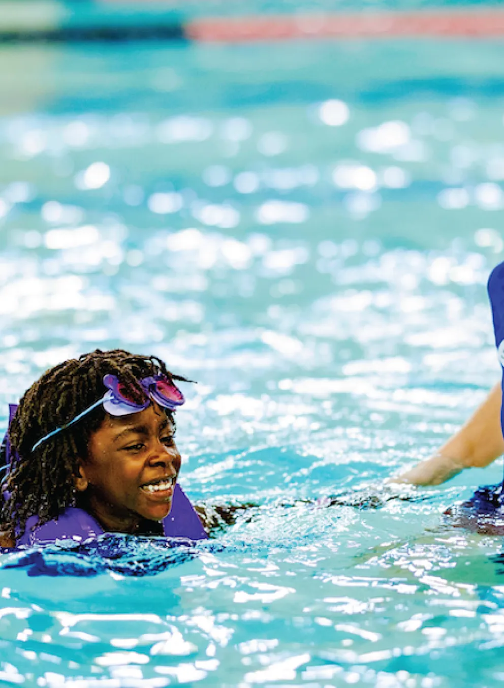 ymca pools and swimming with instructor and child swim lesson in indoor pool