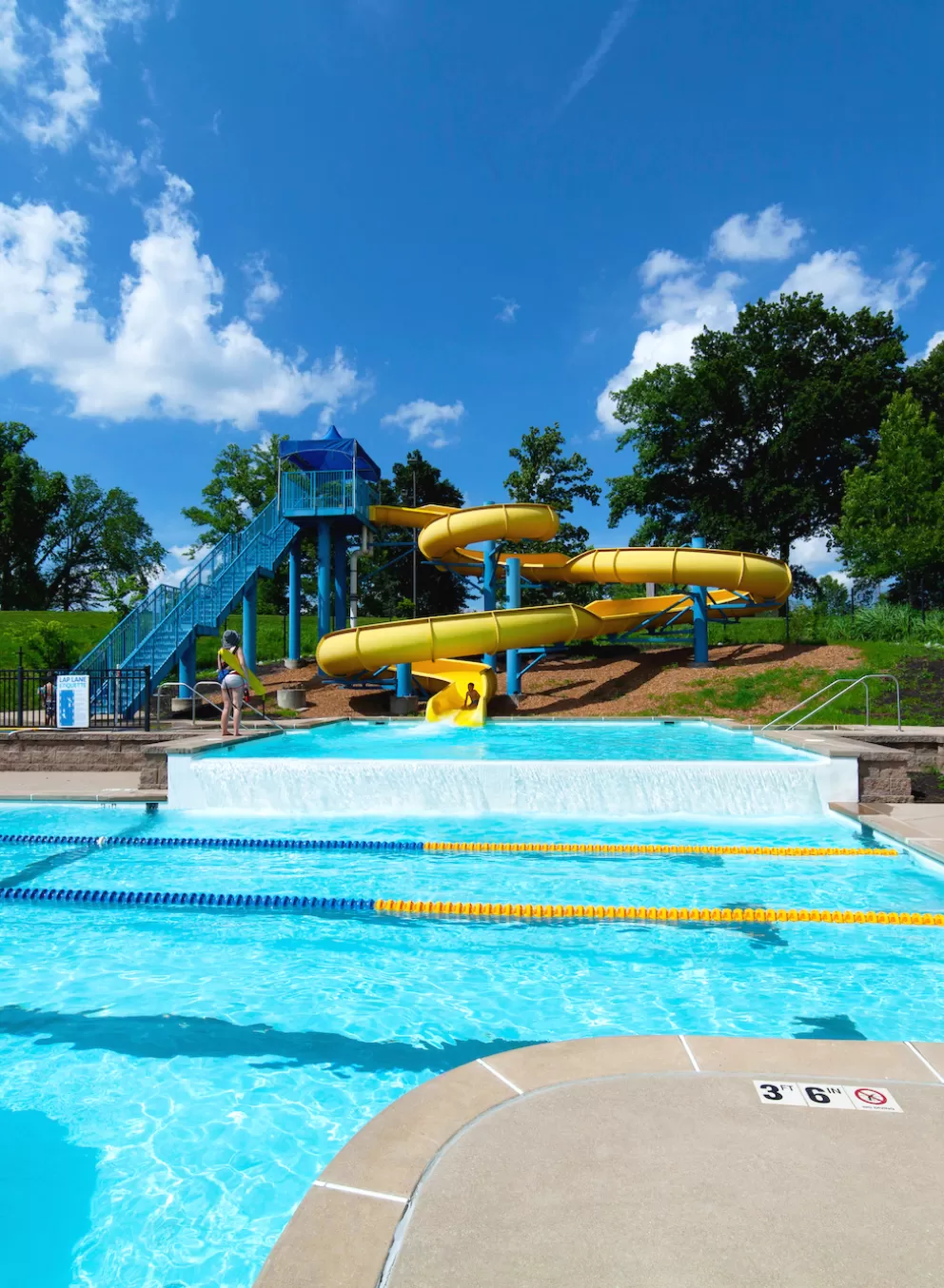 Carondelet Park Rec Complex Gym St. Louis, MO Outdoor Aquatic Center featuring a 2.5-story yellow water slide