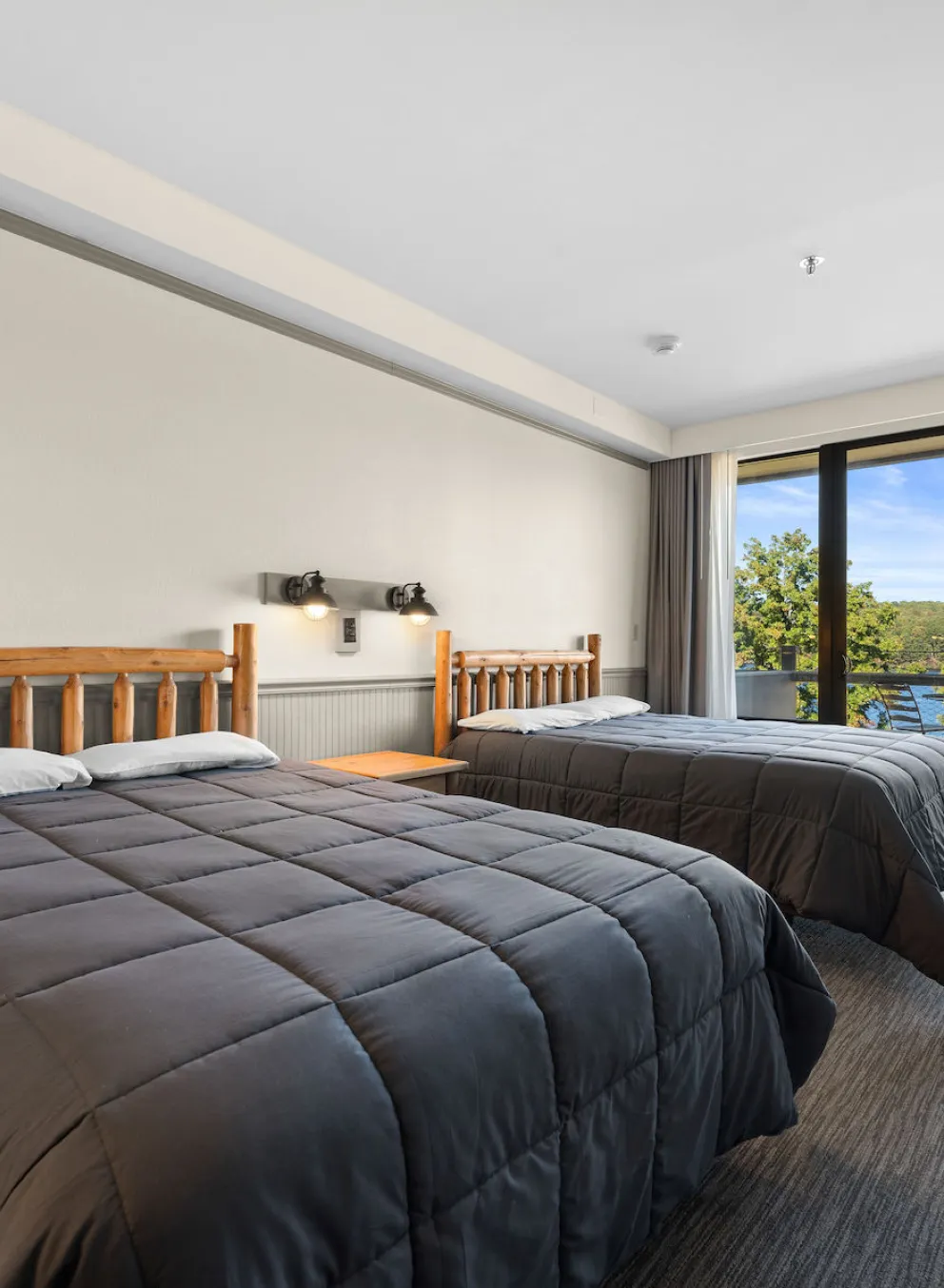 YMCA Trout Lodge in Potosi, MO Hotel Lodge Room Balcony with Patio Furniture and a Lake View of Sunnen Lake