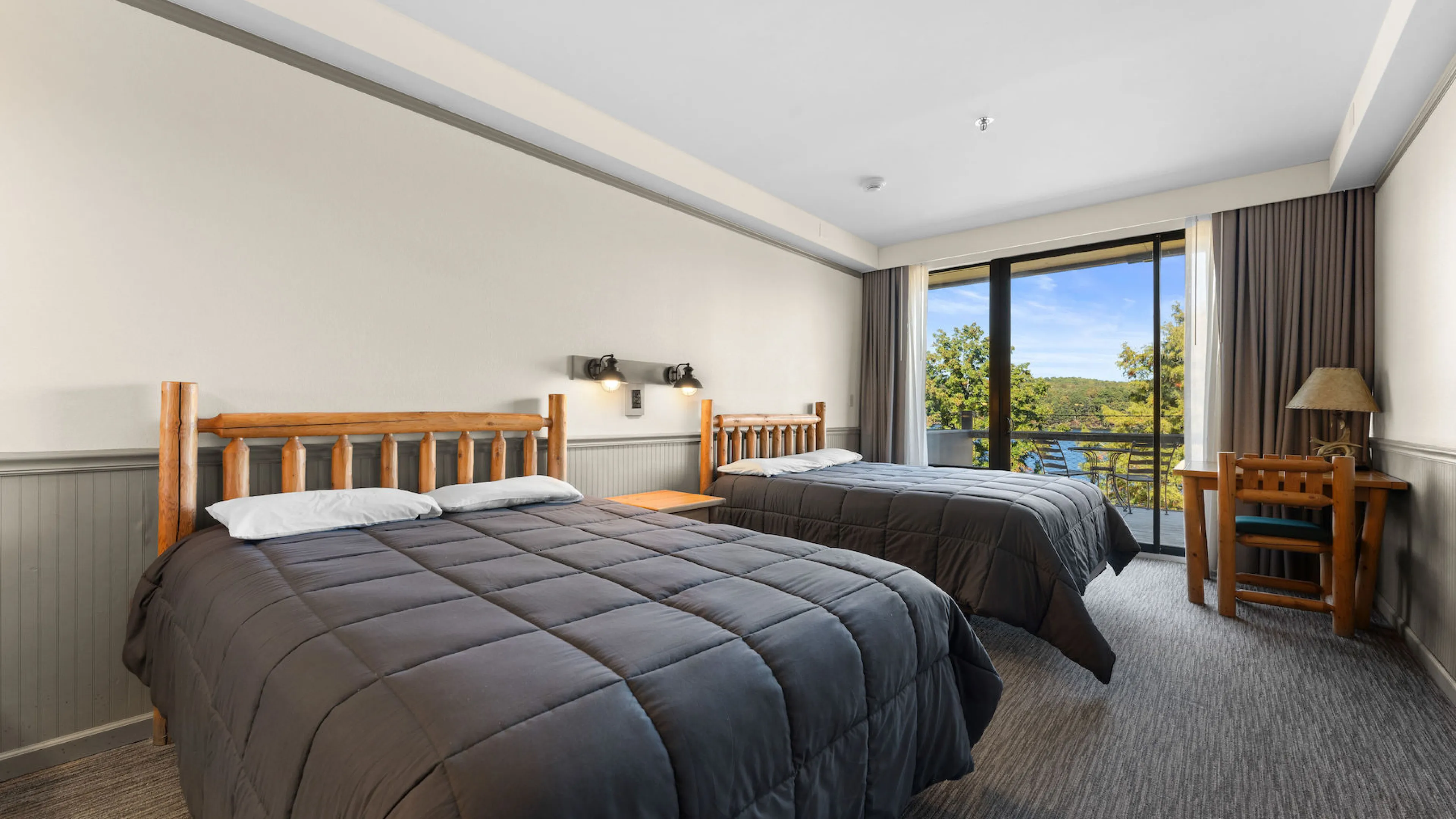 YMCA Trout Lodge in Potosi, MO Hotel Lodge Room Balcony with Patio Furniture and a Lake View of Sunnen Lake