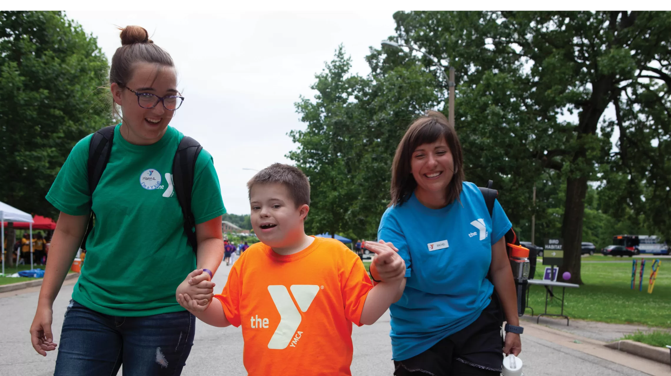 Counselors walking with boy