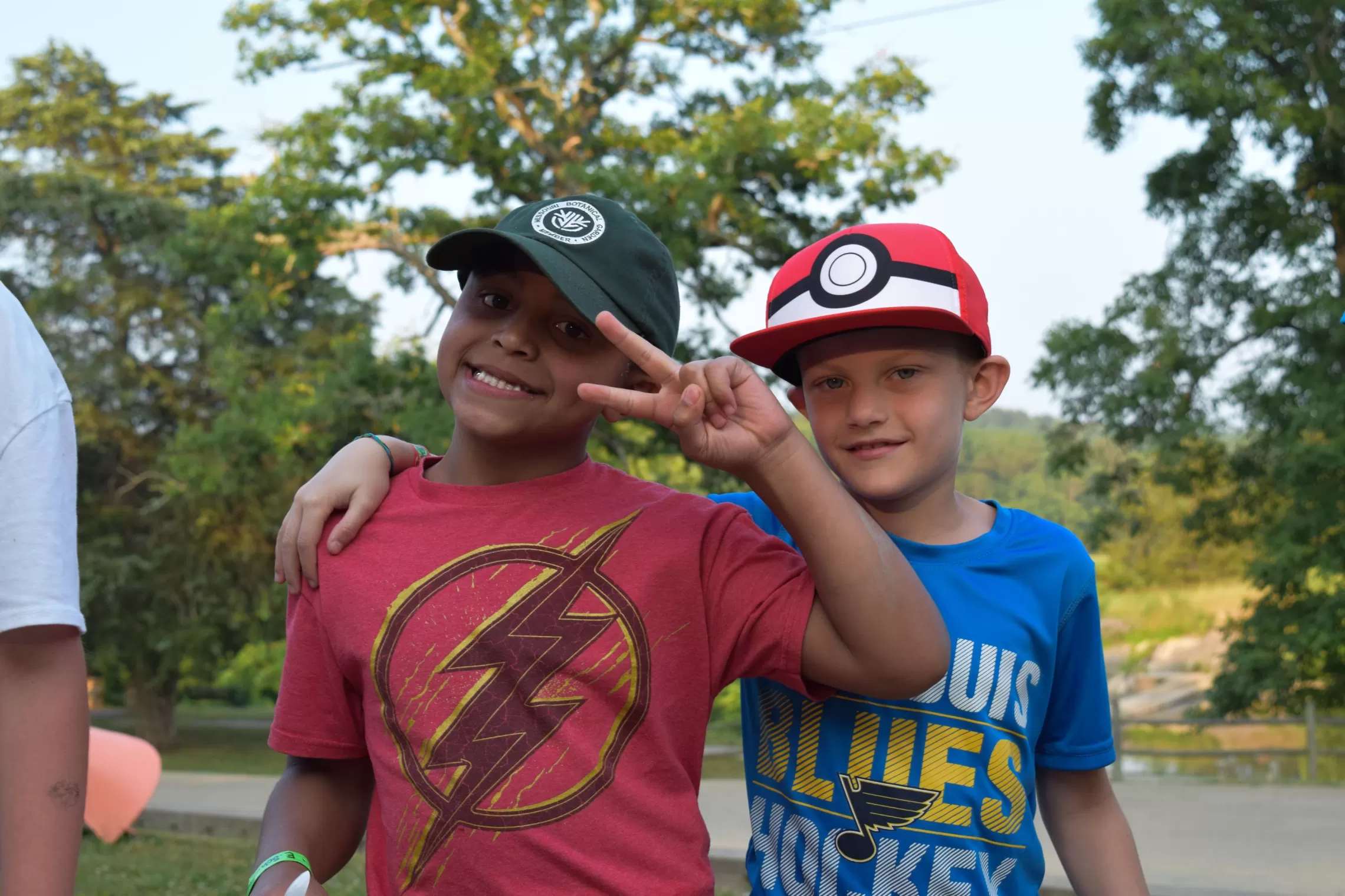 two young boys smiling and posing for photo