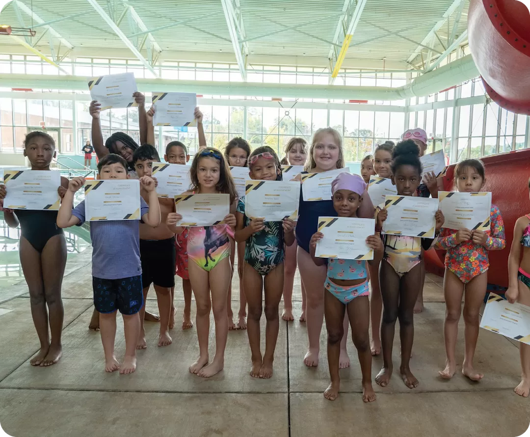 YMCA Go for Green Water Safety Program Class Participants with Certificates of Achievement