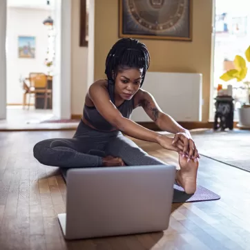 woman stretching at home