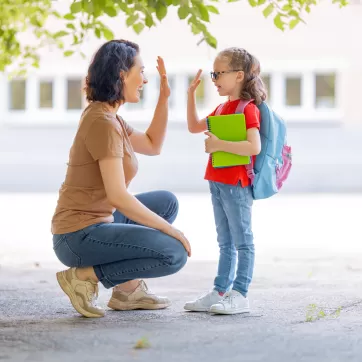 kid going back to school with their parent