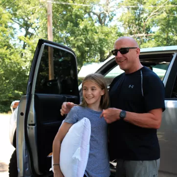 dad dropping off daughter at ymca camp lakewood