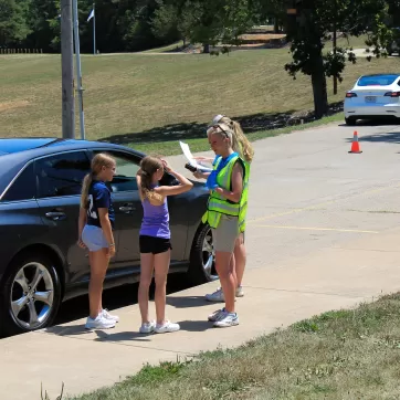 two young campers at camp check-in for ymca camp lakewood