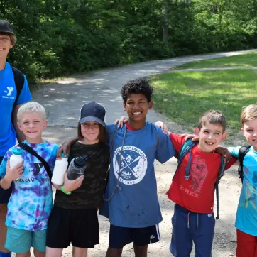 young campers and counselor smiling at ymca camp lakewood