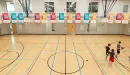 Thumbnail: Gymnasium with 6 basketball hoops. Indoor track overhead.