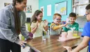 Thumbnail: y club staff doing a science experiment with y club participants