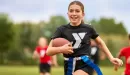 Thumbnail: ymca youth flag football participant running down field holding football