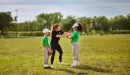 Thumbnail: ymca youth sports baseball coach showing a batter how to hold the baseball bat