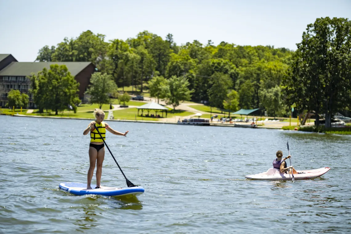 Girls paddle-boarding and kayaking on Sunnen Lake at YMCA Trout Lodge in Potosi, MO 