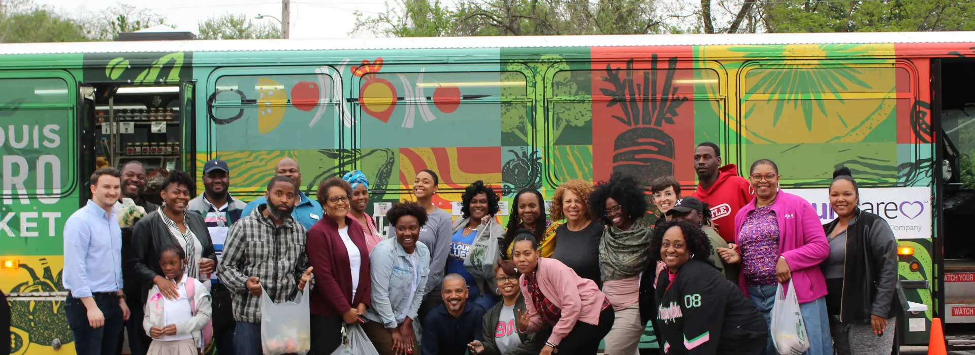 An image of the diverse group who helped run and volunteer to work on the YMCA's Metro Market Bus.