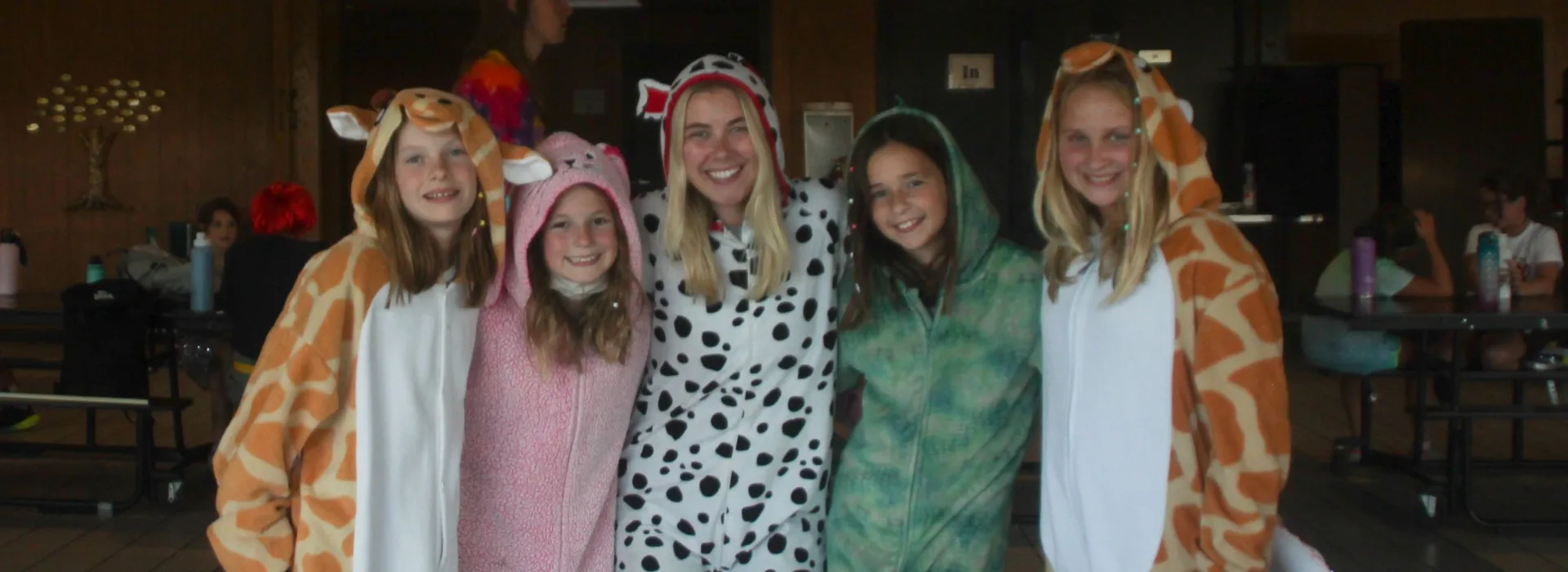five girls in full length animal costumes for crazy campfire