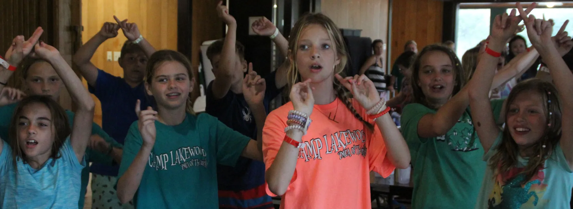 girls in Lakewood tshirts following along to some moves