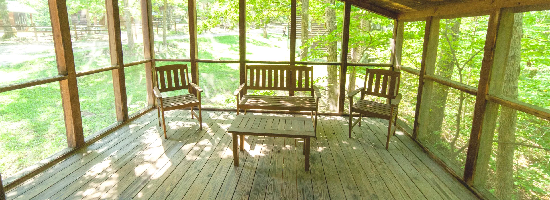 trout lodge screened in porch in forest view cabins