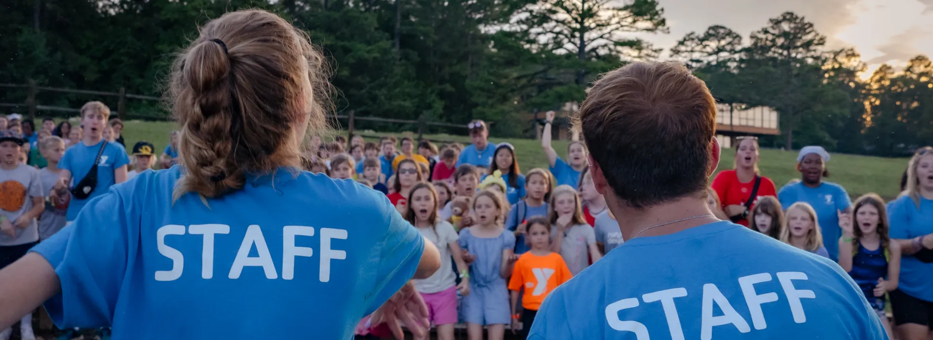 Staff leading a group at campfire