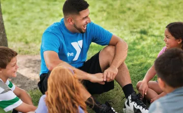 camp counselor with campers