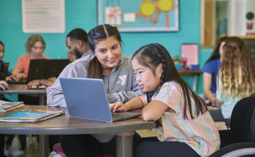 young woman tutoring a little girl at the YMCA