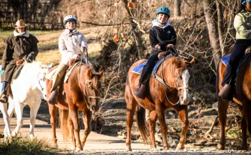 School group goes on a horseback trail ride as an Outdoor Education program activity add-on